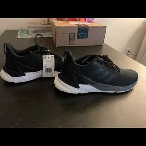 Woman’s adidas black. Never worn 9.5
